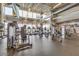 A community fitness center equipped with modern machines and large windows for natural lighting at 10726 E Tallahassee Ave, Mesa, AZ 85212