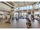 A community fitness center equipped with modern machines and large windows for natural lighting at 10726 E Tallahassee Ave, Mesa, AZ 85212