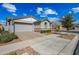 Charming single-Gathering home featuring a manicured lawn, stone accents, and a two-car garage at 10726 E Tallahassee Ave, Mesa, AZ 85212