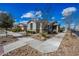 Well-maintained home with neat landscaping, decorative stone accents, and a welcoming facade under a bright sky at 10726 E Tallahassee Ave, Mesa, AZ 85212