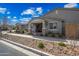 Charming home with a covered porch, stone pillars, and tastefully landscaped front yard at 10726 E Tallahassee Ave, Mesa, AZ 85212