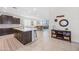 Beautiful kitchen with a central island, modern countertops and views of the living room, creating an open and inviting space at 10726 E Tallahassee Ave, Mesa, AZ 85212