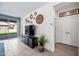 Comfortable living room with access to the outdoor space, a stylish entertainment center, and ample natural light at 10726 E Tallahassee Ave, Mesa, AZ 85212