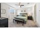 Main bedroom featuring a plush king bed, ceiling fan, and bedside tables, creating a comfortable and inviting retreat at 10726 E Tallahassee Ave, Mesa, AZ 85212