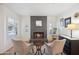 Cozy living room with fireplace and light-filled windows at 10810 E San Salvador Dr, Scottsdale, AZ 85259