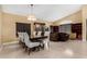 Elegant dining area with a large table, seating for six, and stylish decor at 11406 W Piccadilly Rd, Avondale, AZ 85392