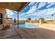 Inviting backyard pool surrounded by patio space, ideal for relaxation and outdoor enjoyment at 11406 W Piccadilly Rd, Avondale, AZ 85392