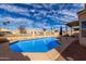 Inviting backyard swimming pool with a patio area, perfect for outdoor relaxation and entertaining at 11406 W Piccadilly Rd, Avondale, AZ 85392