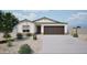 Charming single-story home featuring desert landscaping and a two-car garage at 1185 N 13Th St, Coolidge, AZ 85128