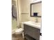 Modern bathroom featuring a gray vanity, white sink, and a walk-in shower at 12543 W Brandywine W Dr, Sun City West, AZ 85375