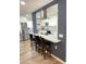 Bright kitchen features white cabinets, stainless appliances, and an island with bar stool seating at 12543 W Brandywine W Dr, Sun City West, AZ 85375
