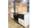 Modern kitchen with stainless steel appliances, stylish white cabinets, and a kitchen island with granite countertops at 12543 W Brandywine W Dr, Sun City West, AZ 85375
