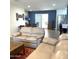 Spacious living area with a comfortable sofa, dining area, and view into the kitchen at 12543 W Brandywine W Dr, Sun City West, AZ 85375