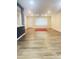 Inviting living room with a ceiling fan, natural light, wood-look floors, and an open concept layout at 12543 W Brandywine W Dr, Sun City West, AZ 85375
