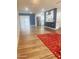 Bright living room with wood-look flooring, accent wall, sliding glass doors, and an open floor plan at 12543 W Brandywine W Dr, Sun City West, AZ 85375