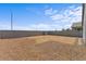 Large backyard, enclosed by a block wall, offering privacy and ample space for outdoor activities at 13171 W Buckskin Trl, Peoria, AZ 85383