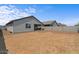 Spacious backyard enclosed by a block wall, with a covered patio perfect for outdoor entertaining at 13171 W Buckskin Trl, Peoria, AZ 85383