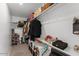 Walk-in closet with shelves, hanging rods, and storage for clothes and accessories at 13171 W Buckskin Trl, Peoria, AZ 85383