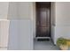 Front door entrance with a welcoming mat and a potted plant at 13171 W Buckskin Trl, Peoria, AZ 85383