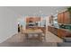 Open-concept kitchen and dining area with stainless steel appliances and tile flooring at 13171 W Buckskin Trl, Peoria, AZ 85383