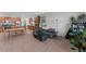 Bright and spacious living room flowing seamlessly into a modern kitchen with a large island at 13171 W Buckskin Trl, Peoria, AZ 85383