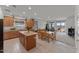 Open-concept kitchen and living room with modern finishes, granite countertops, stainless steel appliances and lots of light at 13171 W Buckskin Trl, Peoria, AZ 85383