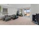 Inviting living room with a sliding glass door to the backyard patio at 13171 W Buckskin Trl, Peoria, AZ 85383