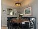 Inviting dining area featuring a unique light fixture, custom bench seating and tasteful decor at 13801 N 111Th Ave, Sun City, AZ 85351