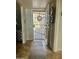 Inviting entryway with security screen door and stylish rug leading into the home at 13801 N 111Th Ave, Sun City, AZ 85351