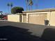 View of the home's side exterior showing the garage and potential access gate at 13801 N 111Th Ave, Sun City, AZ 85351