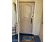 Close-up of the front door, showing a beautiful doormat with a truck design at 13801 N 111Th Ave, Sun City, AZ 85351