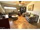 Cozy living room with tile flooring, ceiling fan, comfortable seating, and ample natural light at 13801 N 111Th Ave, Sun City, AZ 85351