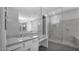 Bright bathroom with glass shower, granite counters, and vanity area at 14562 W Georgia Ave, Litchfield Park, AZ 85340