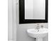 Close up of sleek, white, pedestal bathroom sink at 14562 W Georgia Ave, Litchfield Park, AZ 85340