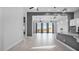 Open-concept living room with tile floors, ceiling fans and backyard views at 14562 W Georgia Ave, Litchfield Park, AZ 85340