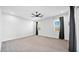 Large main bedroom with natural lighting, carpet flooring, ceiling fan, and neutral walls at 14562 W Georgia Ave, Litchfield Park, AZ 85340
