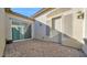 Private patio area with pavers, a sliding glass door, and neutral wall color at 14562 W Georgia Ave, Litchfield Park, AZ 85340