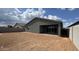 Exterior shot of the backyard with partial view of the covered patio at 15769 W Cheryl Dr, Waddell, AZ 85355