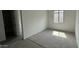 Large bedroom featuring hard wood flooring, baseboard trim, and natural lighting at 15769 W Cheryl Dr, Waddell, AZ 85355