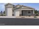 Beautiful single-Gathering home featuring a three-car garage and manicured landscaping at 15769 W Cheryl Dr, Waddell, AZ 85355