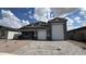 Beautiful single-Gathering home with a three-car garage, desert landscaping, and a paver driveway at 15769 W Cheryl Dr, Waddell, AZ 85355