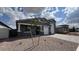 Charming home with a two car garage, desert landscaping, and neutral exterior paint at 15769 W Cheryl Dr, Waddell, AZ 85355