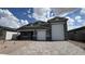 Charming single Gathering home features a two car garage, brick driveway, and low maintenance desert landscaping at 15769 W Cheryl Dr, Waddell, AZ 85355