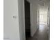 Hallway features hard wood flooring, neutral paint, and recessed lighting at 15769 W Cheryl Dr, Waddell, AZ 85355