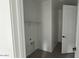 Laundry room features white walls, hard wood flooring, and in-unit hookups at 15769 W Cheryl Dr, Waddell, AZ 85355