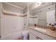 Full bathroom featuring shower/tub, granite vanity, and neutral tile flooring at 1701 E Colter St # 10, Phoenix, AZ 85016
