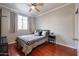 Bedroom with natural light, wood floors, and modern decor at 1701 E Colter St # 10, Phoenix, AZ 85016