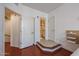 Bright bedroom with tiled entryway to a full bathroom at 1701 E Colter St # 10, Phoenix, AZ 85016