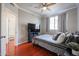 Comfortable bedroom with bright natural light, ceiling fan, and flatscreen TV at 1701 E Colter St # 10, Phoenix, AZ 85016
