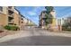 Welcoming entrance to a condominium community with gated access and lush landscaping at 1701 E Colter St # 10, Phoenix, AZ 85016